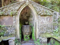 Grotto on the grounds of Plas Newydd, home to the Ladies of Llangollen, Wales. The font was brought over in the 19th century from the nearby ruins of Valle Crucis Abbey