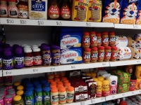 Shelves of groceries. Lucy Sparrow's 8 'till late all-felt convenience store, on LIttle West 12th Street, under the High Line in New York.