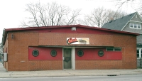 A great sign is complemented by a building with an even more creative window treatment. Comb Hairport, Waukegan, Illinois, 2005
