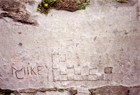 Checkerboard pattern, Mike C. Chicago lakefront stone carvings south of Montrose Harbor. 2002