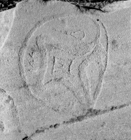 Syringe and symbols. Lost. Chicago lakefront stone carvings, south of Montrose Harbor. 2003