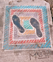 Feet on colorful grid, painted 1993 and refreshed 1997. Lost. Chicago lakefront stone paintings, south of Montrose Harbor. Before 2003