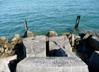 Watching the lake, with gang signs. Lost. Chicago lakefront stone drawings, south of Montrose Harbor. 2008