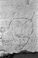 Devil face. Aron Packer photo. Chicago lakefront stone carvings, Montrose Harbor.