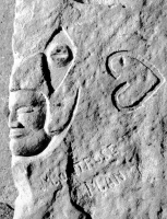 Montrose Man, face, eye and heart. Aron Packer photo. Chicago lakefront stone carvings, Montrose Harbor. 1988