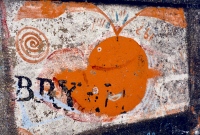 Orange whale. Aron Packer photo. Chicago lakefront rock paintings, Montrose Harbor. 1986