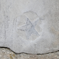 Star, carved by Don Di Sante, detail. Chicago lakefront stone carvings, Montrose Beach. 2022 Star, carved by Don Di Sante, detail. Chicago lakefront stone carvings, Montrose Beach. 2022