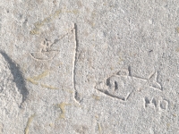 Fisherman and large fish, detail. Chicago lakefront stone carvings, south of Montrose Harbor. 2008