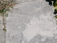 Partial heart with MG, SD in a triangle. Chicago lakefront stone carvings, south of Montrose Harbor. 2023