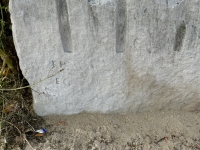 FP + EC (vertical). Chicago lakefront stone carvings, Montrose Dog Beach. 2023