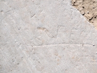 PER, with a flourish. Chicago lakefront stone carvings, Montrose Dog Beach. 2023 PER, with a flourish. Chicago lakefront stone carvings, Montrose Dog Beach. 2023