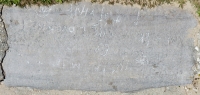 Faded bathing beauty (center of stone, chalked), with writing. Chicago lakefront stone carvings, Montrose Beach. 2019