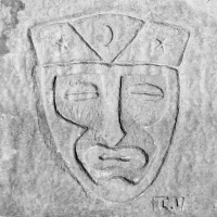 Mask with moon and stars, signed I.V. One of the best of all the lakefront carvings, probably based on the Kon-Tiki logo. Chicago lakefront stone carvings, Montrose Beach. 2017