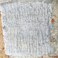 K-R, Honkey, 8-28-78, Guy, cross, Lil Rican, Z+P. Guy and Honkey are also carved into the Puerto Rican flag nearby. Chicago lakefront stone carvings, Montrose Beach. 2020