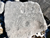 8/23/42, cursive script. Chicago lakefront stone carvings, south of La Rabida Hospital. 2025