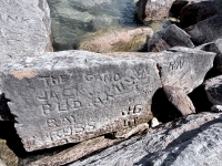 Autograph rock: The Gang, Jack, Bud, Ray,  Russ, John, Marilyn, JG 67, RN, others. Chicago lakefront stone carvings, south of La Rabida Hospital. 2026