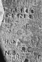 Autograph rock: AB, Mabel Gene, Billy, RN, H.J., N.B., R.C., J, others. Chicago lakefront stone carvings, south of La Rabida Hospital. 2026