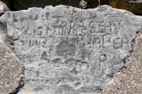 Autograph rock: John, Todo, Zigmond S., Steve Barber, Buns, Acorn, others. Chicago lakefront stone carvings, between 45th Street and Hyde Park Blvd. 2020a