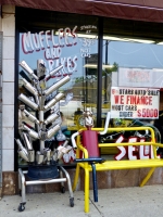 Muffler tree and another muffler man relaxing at 6 Stars Auto Body in July 2014. Lawrence Avenue near Sacramento, Chicago Muffler tree and another muffler man relaxing at 6 Stars Auto Body in July 2014. Lawrence Avenue near Sacramento, Chicago