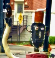 Hand detail, 6 Stars Auto Body sidewalk muffler person in July 2011. Lawrence Avenue near Sacramento, Chicago