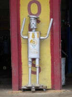 Muffler man with spectacles and facial hair, T&T Muffler & Brakes, Addison Street at Cicero, Chicago