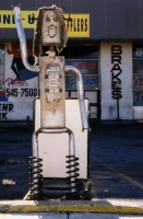 Long-haired muffler person at the former E&T Discount Mufflers, Cicero Avenue at Foster, Chicago