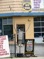 Wide-brimmed, short-legged muffler person, Lawrence Auto Works, Lawrence Avenue at Kenneth, Chicago