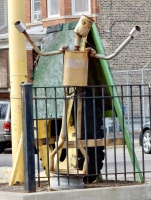 Dancing muffler person, Rudy's Muffler, Pulaski Road at Potomac, Chicago