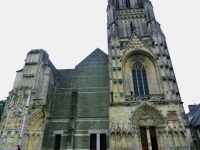 St. Lo Cathedral, heavily bombed during the Battle of Normandy -- the town was devastated. The ruined faced was replaced with a plain brick wall