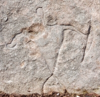 Triangle-bodied figure, detail. Chicago lakefront stone carvings at Fullerton. 2019