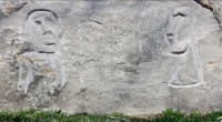 Three enigmatic figures, Easter Island style, RS -05-, near hair washers. Chicago lakefront stone carvings at Fullerton. 2018