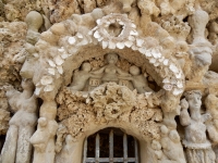 Small figure and and arch above gate, Le Palais Idéal du Facteur Cheval, Hauterives, France