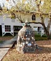 Memory jug-like mound, with the Rolling Chair Ramp gallery behind it, Howard Finster's Paradise Garden, 2016