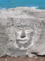 Hirsute face. Made at the June 20, 2026, DIY carving workshop. Chicago lakefront stone carvings, Promontory Point. 2026