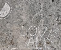 Fruit slice, LOVE ALL. Chicago lakefront stone carvings, Promontory Point. 2026