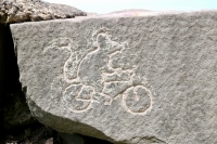 Rat on a bike, made by Matt Bergstrom during the carving workshop led by Roman Villareal and Joel Cardenas, May 28, 2022. Chicago lakefront stone carvings, Promontory Point. 2022