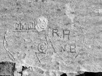Mishko, devil face, heart with R.R. and N.B., reversed treble clef and more. Level 4. Chicago lakefront stone carvings, Promontory Point. 2018 Mishko, devil face, heart with R.R. and N.B., reversed treble clef and more. Level 4. Chicago lakefront stone carvings, Promontory Point. 2018