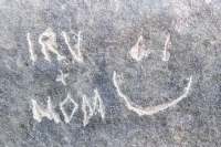 Irv + Mom, smiley face, detail, made during the Oct. 9, 2022, Promontory Point carving workshop. Level 5, vertical. Chicago Lakefront stone carvings, Promontory Point. 2022 Irv + Mom, smiley face, detail, made during the Oct. 9, 2022, Promontory Point carving workshop. Level 5, vertical. Chicago Lakefront stone carvings, Promontory Point. 2022