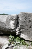Face carving by Joel Cardenas during his carving workshop, May 28, 2022. Level 5, vertical. Chicago lakefront stone carvings, Promontory Point. 2022