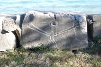 Figure with sun, with face on the right, by Joel Cardena, made during the Oct. 9, 2022, Promontory Point carving workshop. Level 5, vertical. Chicago Lakefront stone carvings, Promontory Point. 2022 Figure with sun, with face on the right, by Joel Cardena, made during the Oct. 9, 2022, Promontory Point carving workshop. Level 5, vertical. Chicago Lakefront stone carvings, Promontory Point. 2022