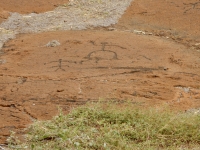 Four-armed figure and bow-legged figure, the Puako petroglyphs
