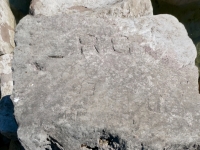 R.C., HA(?). EI, CM. Chicago Lakefront stone carvings, south of La Rabida Hospital. 2025 R.C., HA(?). EI, CM. Chicago Lakefront stone carvings, south of La Rabida Hospital. 2025