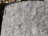 W, A, smiley face, BV. Chicago Lakefront stone carvings, south of La Rabida Hospital. 2025 W, A, smiley face, BV. Chicago Lakefront stone carvings, south of La Rabida Hospital. 2025