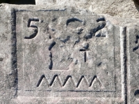 52 with symbols and squiggel from 12-panel carving. Chicago Lakefront stone carvings, south of La Rabida Hospital. 2025 52 with symbols and squiggel from 12-panel carving. Chicago Lakefront stone carvings, south of La Rabida Hospital. 2025
