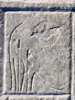 Indeterminant shape from 12-panel carving. Perhaps those are plants on the left and a bat in front of the moon on the right. Chicago Lakefront stone carvings, south of La Rabida Hospital. 2025 Indeterminant shape from 12-panel carving. Perhaps those are plants on the left and a bat in front of the moon on the right. Chicago Lakefront stone carvings, south of La Rabida Hospital. 2025