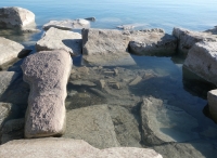 Priapic figure (submerged) and partial female figure. Chicago Lakefront stone carvings, south of La Rabida Hospital. This and other carvings were submerged just a couple of years prior when lake levels were higher. 2025 Priapic figure (submerged) and partial female figure. Chicago Lakefront stone carvings, south of La Rabida Hospital. This and other carvings were submerged just a couple of years prior when lake levels were higher. 2025