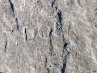 Swastika, Don R. (detail). Chicago Lakefront stone carvings, south of La Rabida Hospital. 2025 Swastika, Don R. (detail). Chicago Lakefront stone carvings, south of La Rabida Hospital. 2025