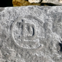 Incomplete peace symbol, CDL (detail), ML, hourglass, NJ Haab. Chicago lakefront stone carvings, south of La Rabida Hospital. 2023 Incomplete peace symbol, CDL (detail), ML, hourglass, NJ Haab. Chicago lakefront stone carvings, south of La Rabida Hospital. 2023