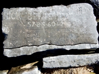 Autograph rock: Rick Bertetto 57-8-9-60-1-2, Ann, Rich, Sharyn, Nancy, GE, RE, RJE, TIK, TK, K Loon.  Chicago lakefront stone carvings, Rainbow Beach. 2019