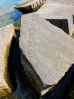 Manfre(d). Chicago lakefront stone carvings, Rainbow Beach jetty. 2022